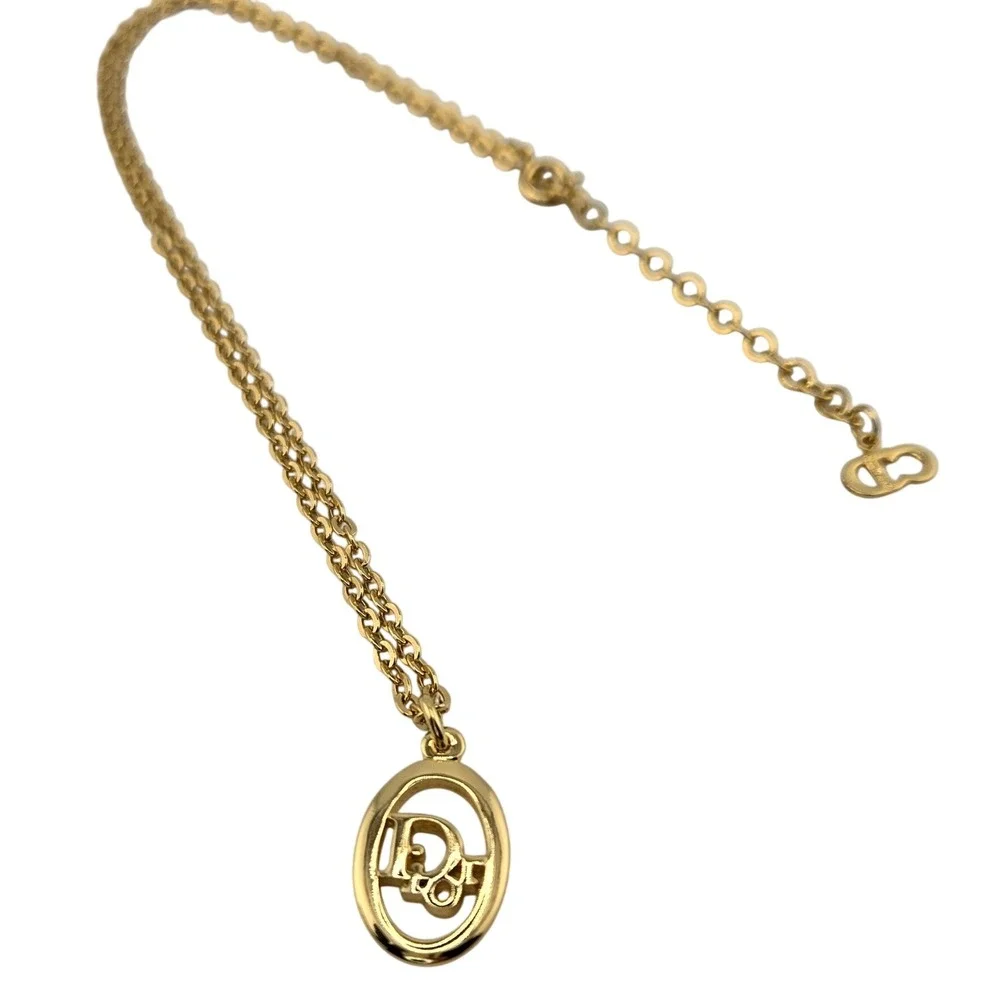 Christian Dior Gold Tone Oval Logo Pendant Necklace Adjustable Chain Vintage